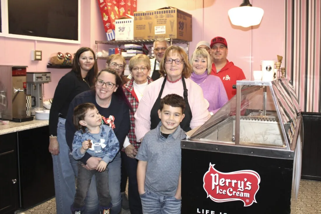 The Jones family behind the counter with the Perry's dipping cabinet